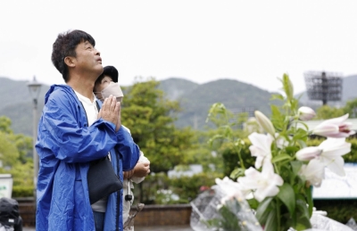 People pray at the Peace Park in Nagasaki on Wednesday, the 78th anniversary of the U.S. atomic bombing of the city.