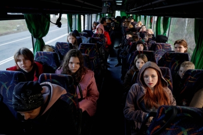 Children from nongovernment controlled territories who attended a Russian-organized summer camp and were then taken to Russia wait for departure to Kyiv, after returning via the Ukraine-Belarus border, in Volyn region, Ukraine on April 7.