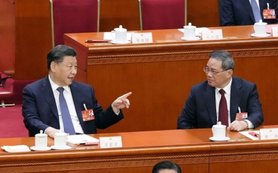 Chinese President Xi Jinping (left) and Premier Li Qiang attend a plenary session of the country's parliament in Beijing in March.