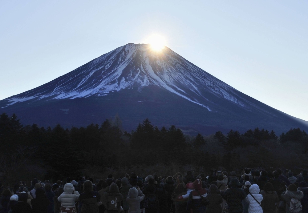 Yamanashi Prefecture will work with police to restrict the number of hikers who can use a route to climb to the summit of Mount Fuji if it becomes dangerous from overcrowding.