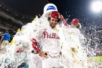 Phillies starter Michael Lorenzen is doused with water by teammate Alec Bohm after throwing a no-hitter against the Nationals in Philadelphia on Wednesday. | USA TODAY / VIA REUTERS