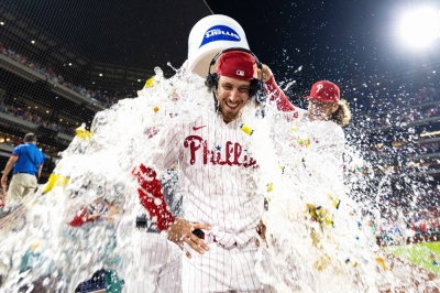 Phillies starter Michael Lorenzen is doused with water by teammate Alec Bohm after throwing a no-hitter against the Nationals in Philadelphia on Wednesday.