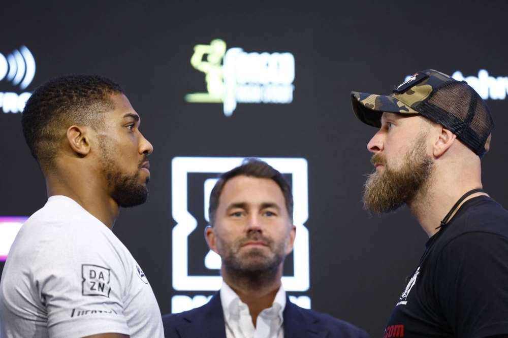 Boxers Anthony Joshua (left) and Robert Helenius face off during a news conference on Wednesday to promote their upcoming bout.