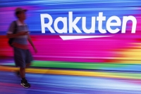 Rakuten Group plans to consolidate its payments and points businesses and fold them into Rakuten Card, its credit card and loans unit. | Bloomberg