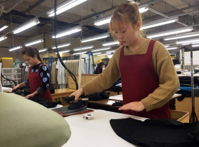 Technical trainees from Vietnam work at a knitwear factory in the city of Mitsuke, Niigata Prefecture, in February 2019. 