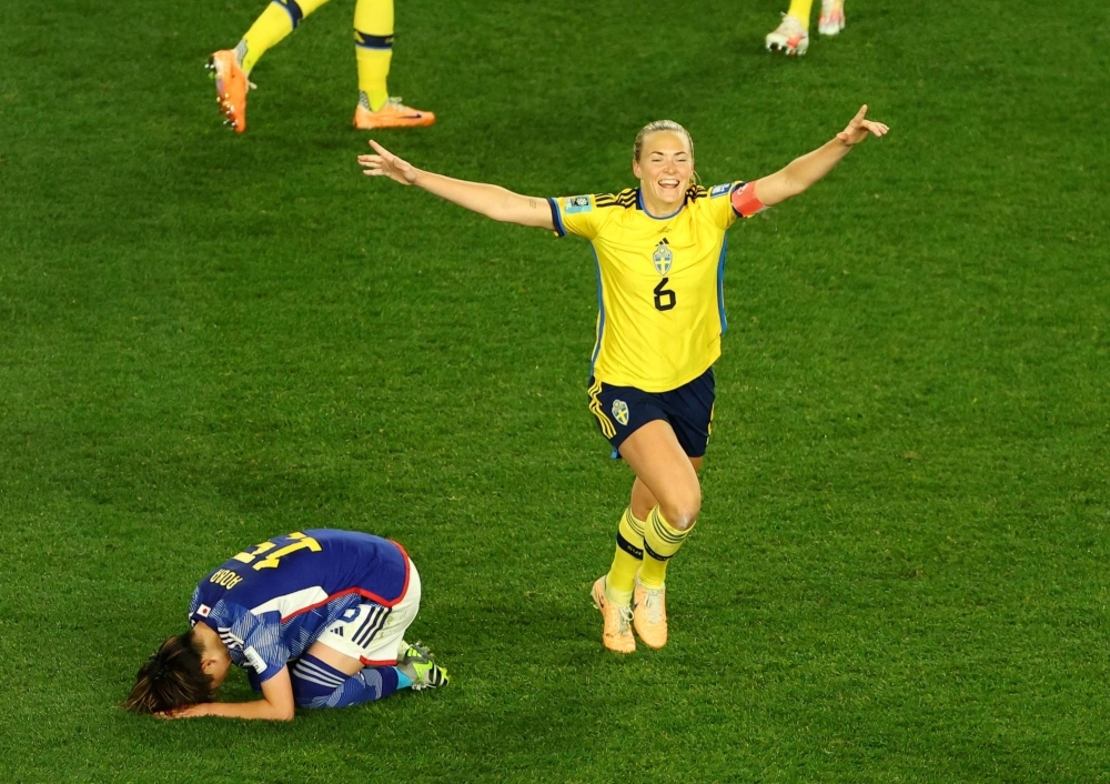 Sweden's Magdalena Eriksson celebrates her team's win over Japan as Aoba Fujino looks dejected, in Auckland on Friday. 