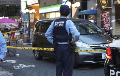 Police at the scene where a car plowed into festival-goers in the city of Shizuoka on Friday. 