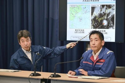 Officials of the Meteorological Agency ask people to be vigilant about Typhoon Lan, during a news conference at the agency in Tokyo on Sunday.