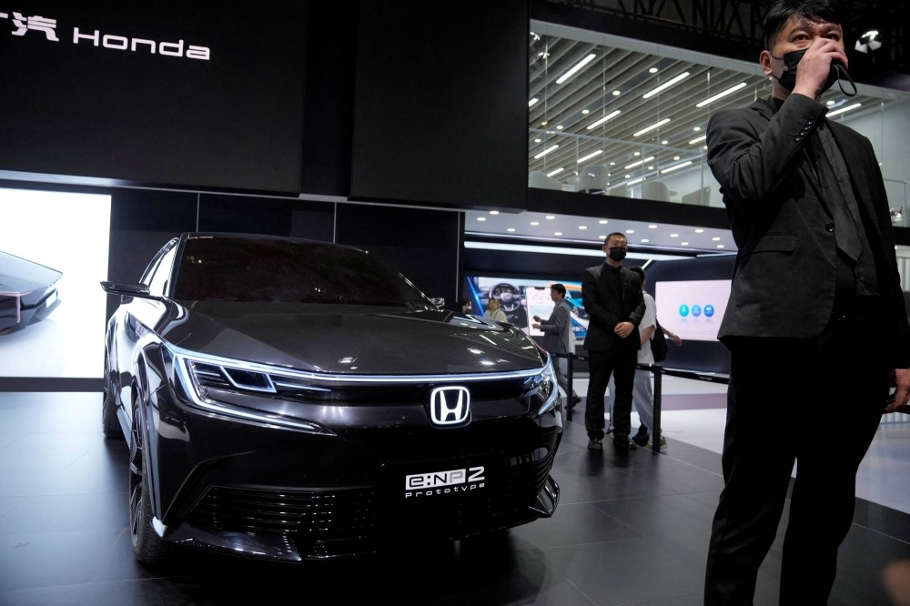 Honda's electric vehicle e:NP2 is displayed at the Auto Shanghai show, in Shanghai in April. The recent weakening of the yen couldn't come at a better time for Japanese automakers, which are struggling in the Chinese market.
