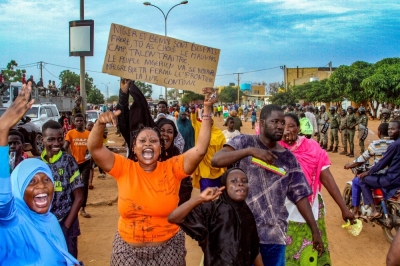 Niger's junta supporters take part in a demonstration in front of a French army base in Niamey, Niger, on Friday.