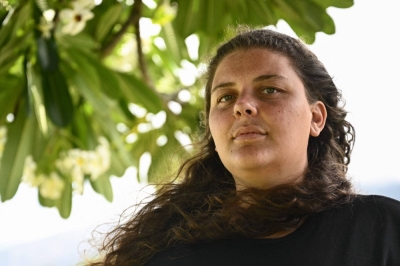 Lahaina resident Annelise Cochran poses for a portrait on Monday, after speaking about her harrowing escape from the flames of the fires in Maui.