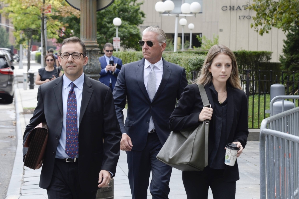 Charles McGonigal, formerly the FBI's top counterintelligence official in New York, arrives with his attorney, Seth DuCharme (left), at the Federal District Court in New York on Tuesday.