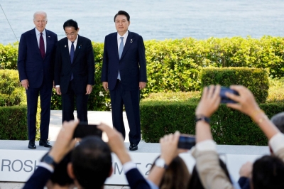 U.S. President Joe Biden, Prime Minister Fumio Kishida and South Korean leader Yoon Suk-yeol attend a photo op on the day of trilateral engagement during the Group of Seven summit at the Grand Prince Hotel in Hiroshima on May 21.