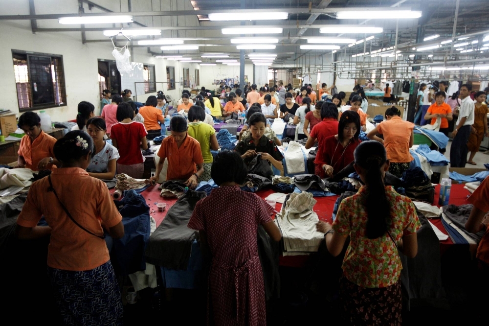 Workers at a garment factory in the Hlaing Tar Yar industry zone in Yangon, Myanmar, in 2010. Fast fashion retailer H&M says it is following up on 20 alleged instances of labor abuse at Myanmar garment factories.