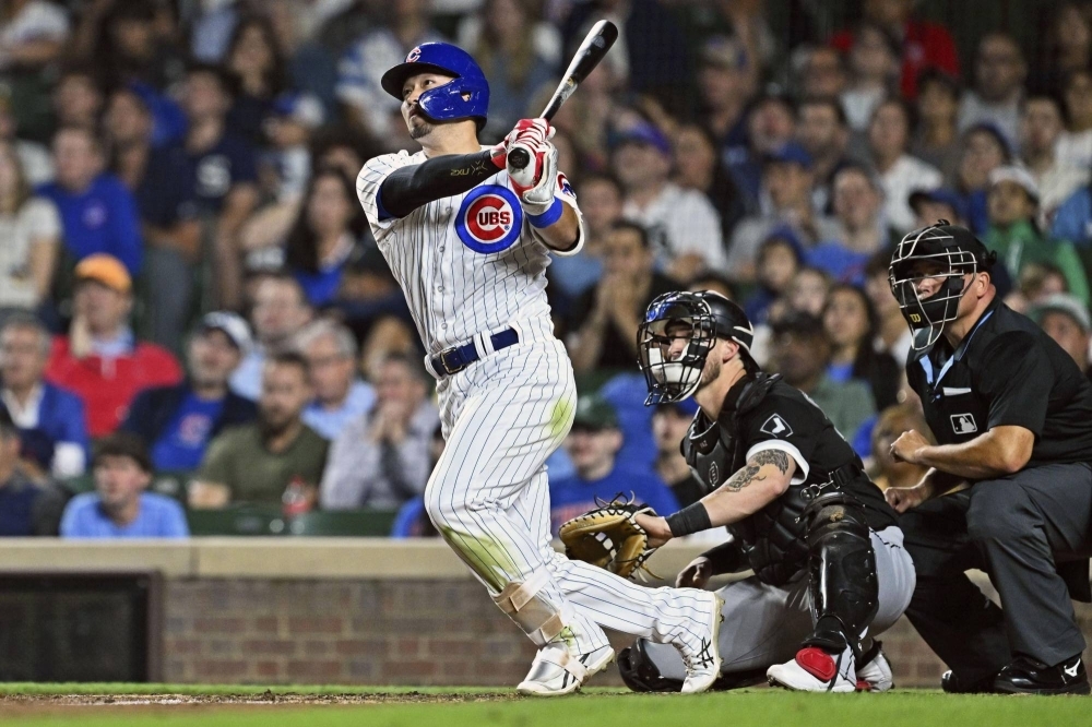 The Cubs' Seiya Suzuki hits a solo home run against the White Sox in Chicago on Tuesday.
