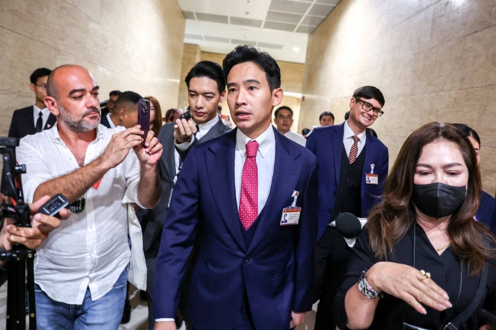 Move Forward Party leader Pita Limjaroenrat leaves after voting for house speaker at the parliament in Bangkok on July 4.