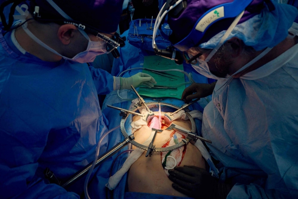 Surgeons work to transplant a pig kidney at a hospital in New York in July. 