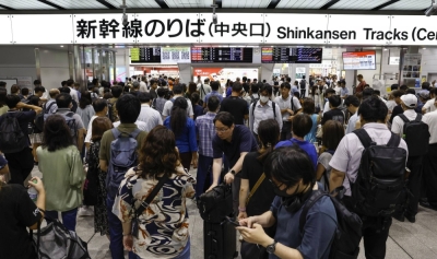 Shin-Osaka Station is crowded with travelers as services resume on Thursday morning.