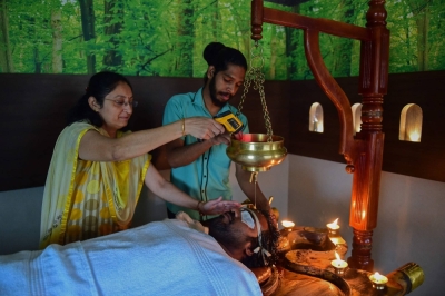 An ayurvedic doctor performs a traditional therapy at SGVP Holistic hospital in Ahmedabad, India, on Tuesday. 