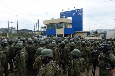Members of the Ecuadorean Armed Forces stand guard outside a penitentiary in Guayaquil, Ecuador, during a joint operation between the police and the military last Saturday. A state of emergency was declared in the country on Aug. 10, following the assassination of popular presidential candidate Fernando Villavicencio.