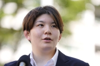 Former Ground Self-Defense Force member Rina Gonoi speaks to reporters in Yokohama in July after exchanging opinions with members of an expert panel set up by the Defense Ministry. | Kyodo