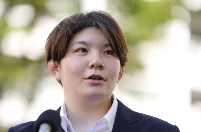 Former Ground Self-Defense Force member Rina Gonoi speaks to reporters in Yokohama in July after exchanging opinions with members of an expert panel set up by the Defense Ministry.