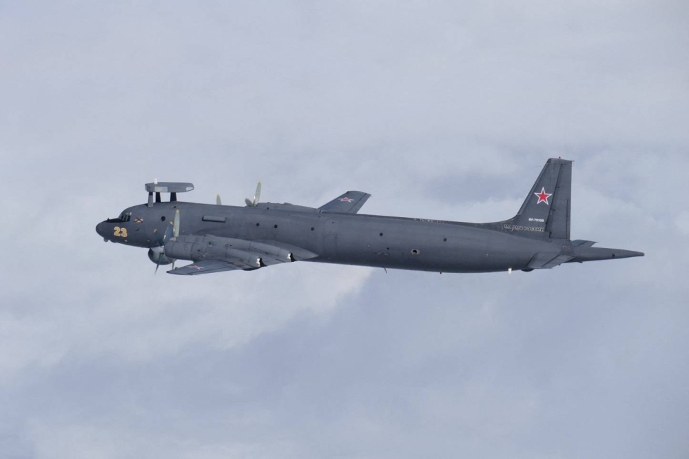 A Russian IL-38 information-gathering aircraft flies between the Sea of Japan and the East China Sea in a photo taken by the Air Self-Defense Force on Friday. 