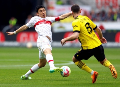 Wataru Endo (left) in action for VfB Stuttgart in April