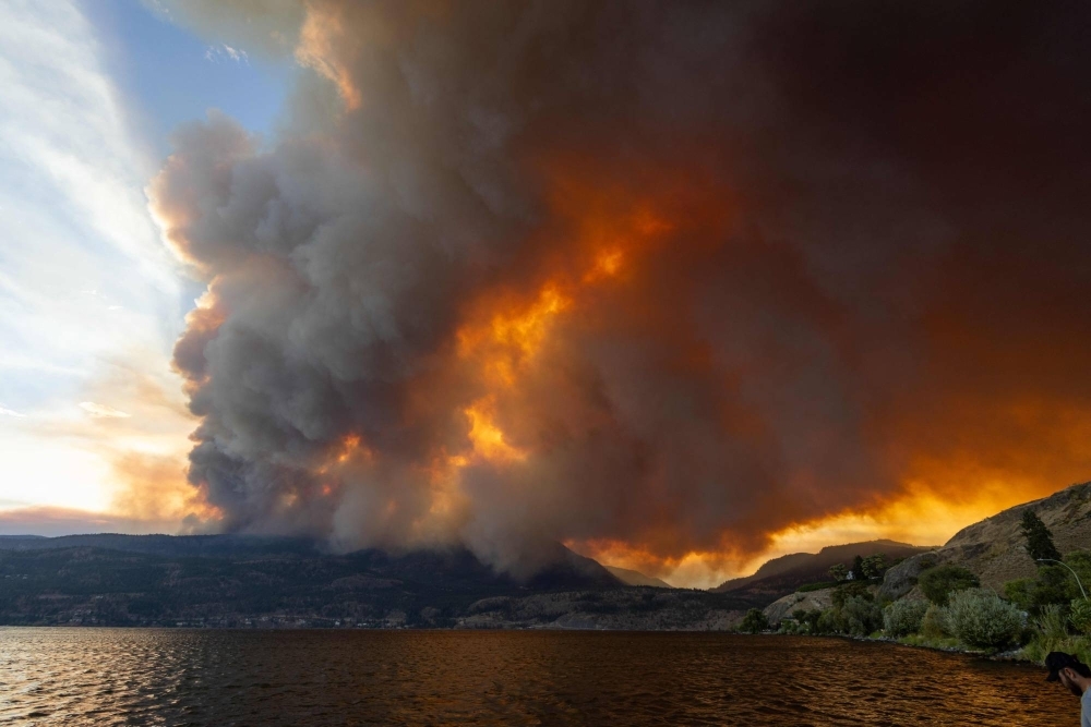 The McDougall Creek wildfire burns in the hills of West Kelowna, British Columbia, on Thursday. 
