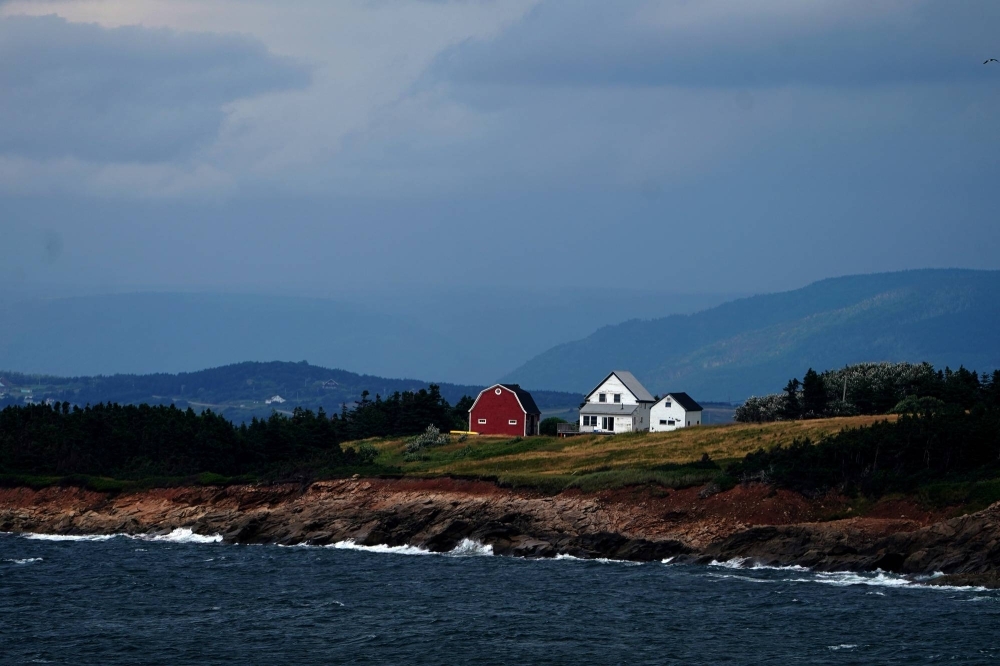 A farm in Cheticamp, Nova Scotia. Nova Scotia has been an appealing destination for farmers due to its historically moderate climate and proximity to the Atlantic Ocean. 