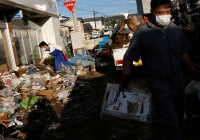 Residents clean up debris in the aftermath of Typhoon Hagibis in Date, Fukushima Prefecture, in October 2019. | Reuters 