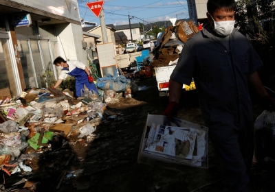 Residents clean up debris in the aftermath of Typhoon Hagibis in Date, Fukushima Prefecture, in October 2019.