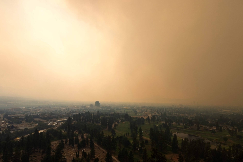 Smoke from a wildfire envelops Kelowna, British Columbia, on Friday. 