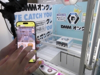 DMM.com's claw machine games placed at a warehouse in Saitama Prefecture can be controlled remotely via a smartphone. | Kyodo