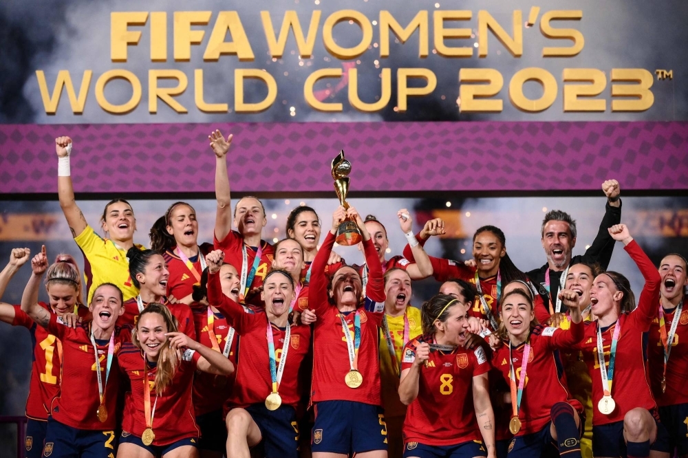 Spain's players celebrate with the trophy after winning the 2023 FIFA Women's World Cup final in Sydney on Sunday.