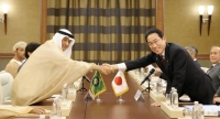 Prime Minister Fumio Kishida shakes hands with Gulf Cooperation Council Secretary-General Jasem al-Budaiwi before their talks in Jeddah, Saudi Arabia, on July 16. | Kyodo
