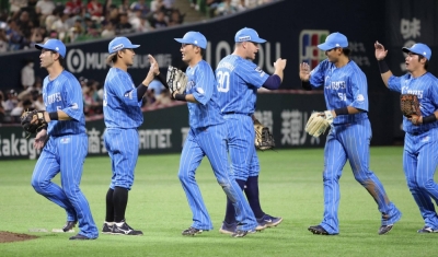 Lions players celebrate after their win over the Hawks in Fukuoka on Sunday.