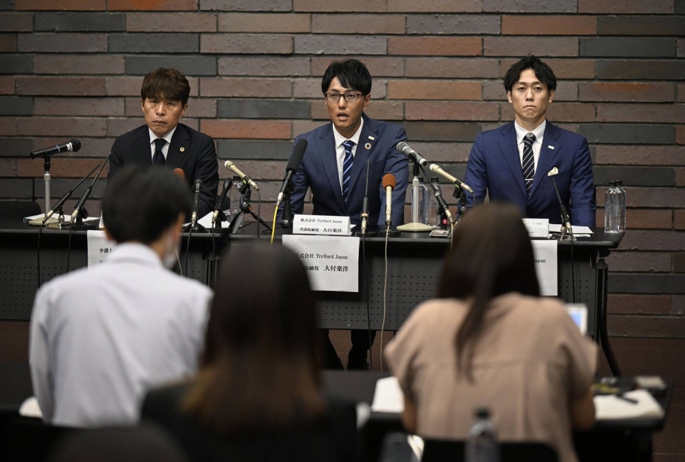 Rakuyo Otsuki (center), CEO of event firm TryHard Japan, during a news conference in Osaka on Monday