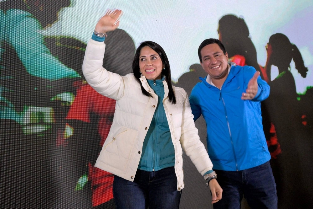 Ecuadorian presidential candidate Luisa Gonzalez (left), celebrates with her supporters in Quito on Sunday.