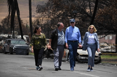 U.S. President Joe Biden (second from rigt), U.S. first lady Jill Biden (right), Hawaii Gov. Josh Green (second from left) and Jaime Green, first lady of Hawaii, visit an area devastated by wildfires in Lahaina, Hawaii, on Monday.