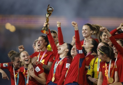 Spain players celebrate with the trophy after winning the World Cup in Sydney on Sunday.  