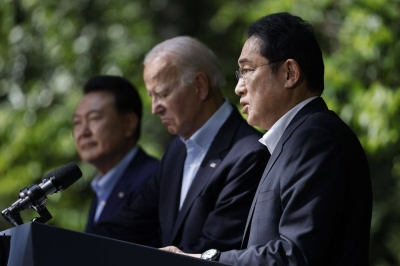 Prime Minister Fumio Kishida, U.S. President Joe Biden and South Korean leader Yoon Suk-yeol attend a news conference during a trilateral summit at Camp David, Maryland, on Friday.