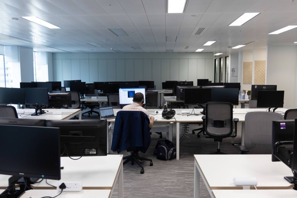 An office worker in London. A new report found that 36% of so-called workpoints — cubicles and desks — are never occupied, "indicating a general oversupply.”