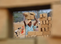 Workers who get paid by the number of bricks they carry risk getting paid less on hot days, says Carolin Kroeger, author of a recent study correlating high temperatures with food insecurity. | REUTERS
