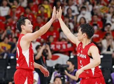 Keisei Tominaga (left) represents the second generation of his family to play at basketball's biggest international tournament.