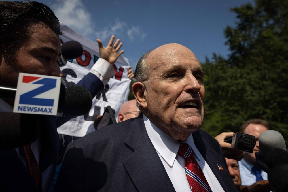 Rudy Giuliani, a former New York City mayor and attorney of former U.S. President Donald Trump, outside the Fulton County Jail in Atlanta on Wednesday after he surrendered to authorities