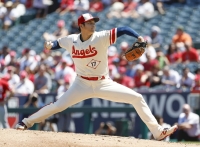 The Angels' Shohei Ohtani pitches against the Reds during the opening game of a doubleheader in Anaheim, California, on Wednesday. | KYODO