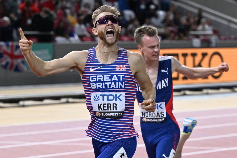 Great Britain's Josh Kerr celebrates as he crosses the finish line to win the men's 1,500-meter final during the World Athletics Championships in Budapest on Thursday.