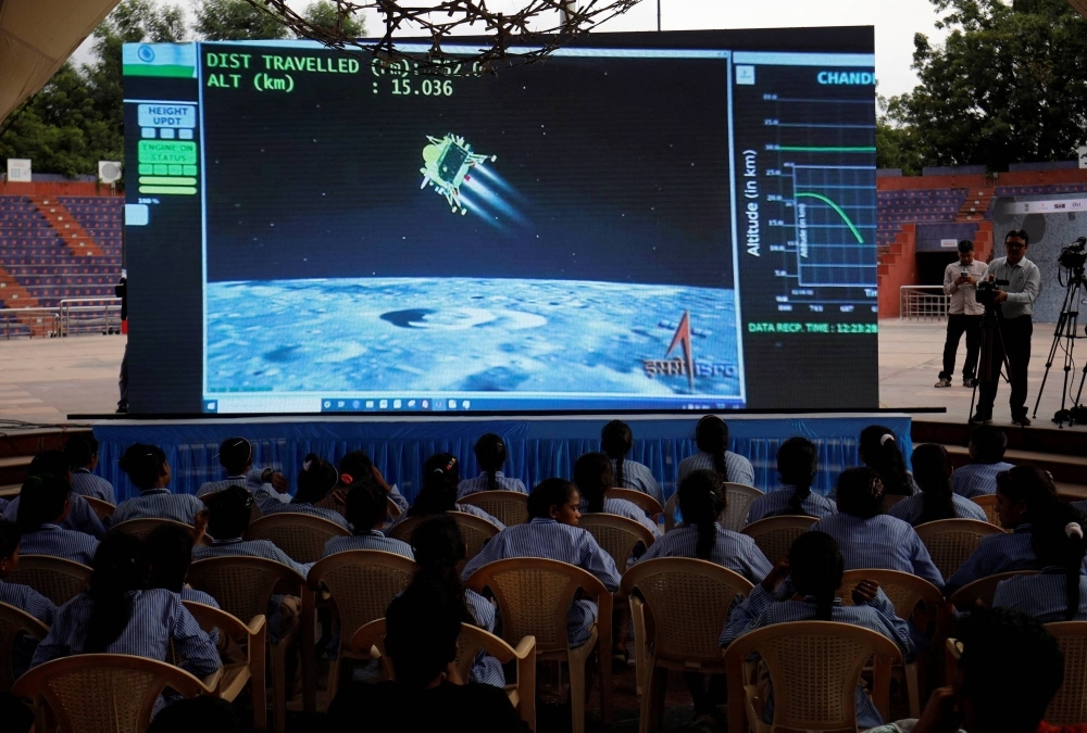 People watch a live stream of Indian spacecraft Chandrayaan-3 landing on the moon, at an auditorium in Ahmedabad, India, on Wednesday.