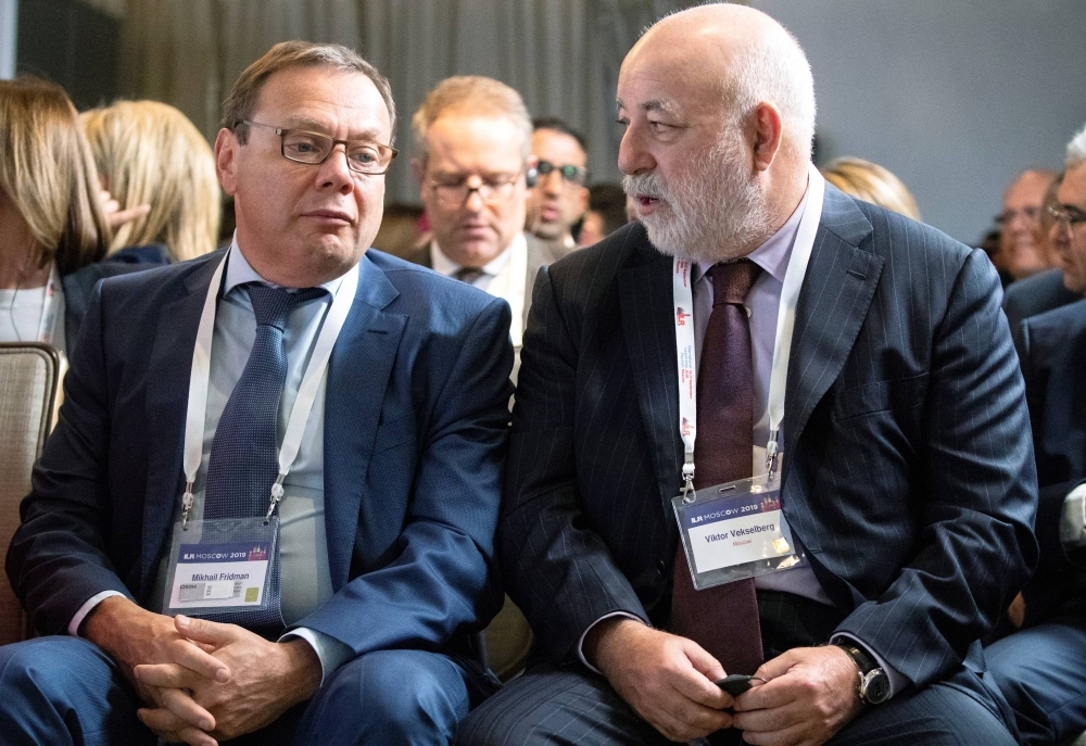 Russian businessman and co-founder of Alfa Group Mikhail Fridman (left) attends a conference in Moscow in September 2019.